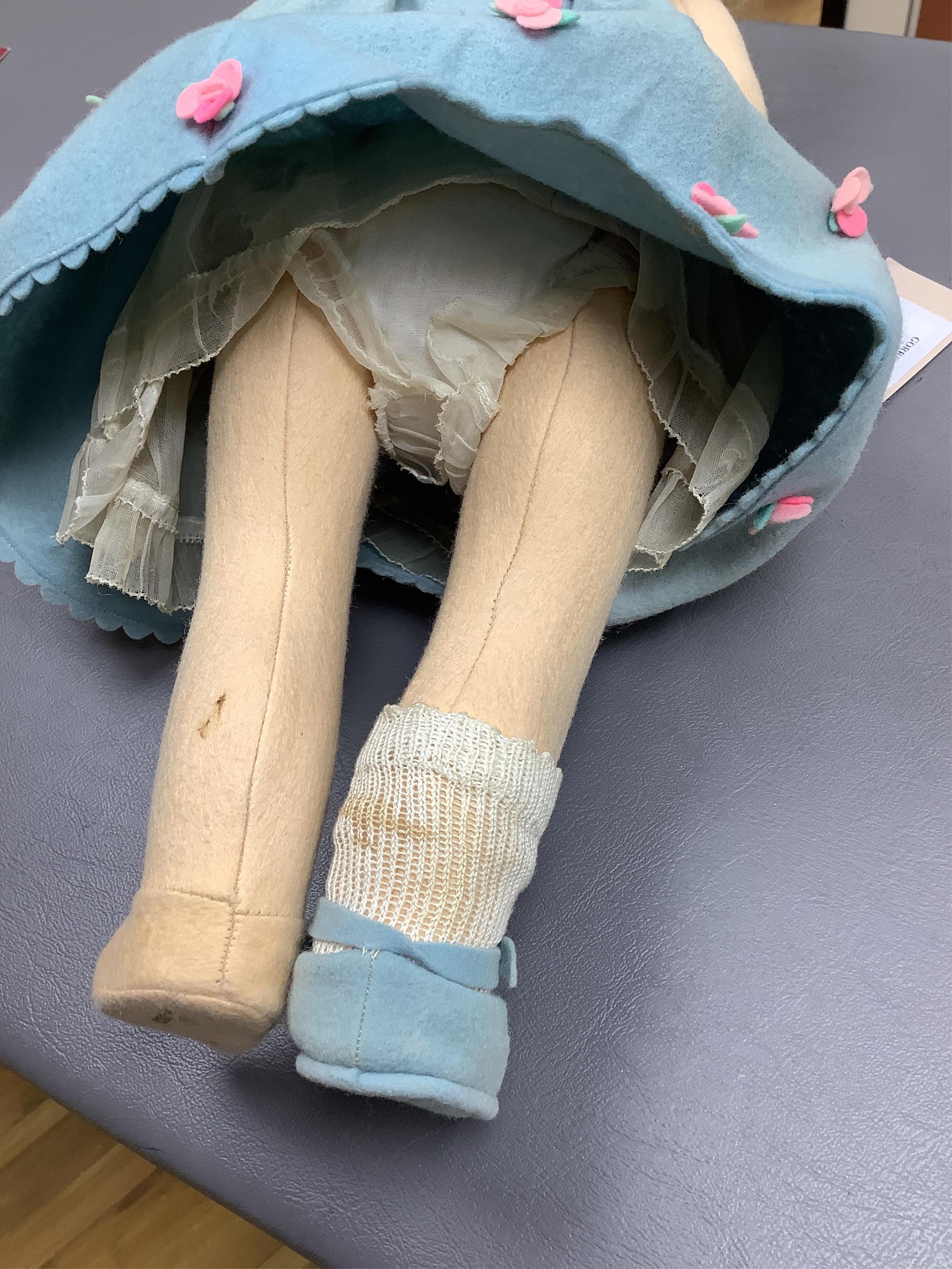 A wool felt Lenci doll with painted features to the face, 42cm long